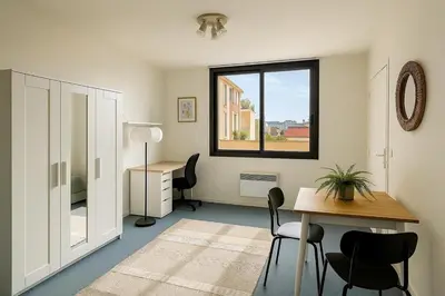 a room with a desk and a table and chairs at Bright studio in Nice - Mobility lease only - WIFI in Nice