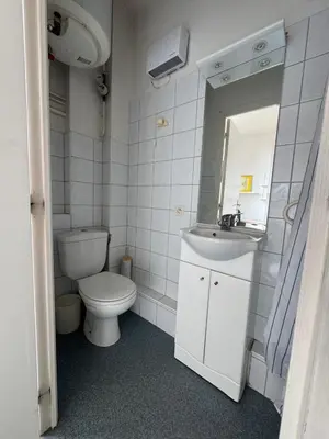a white bathroom with a toilet and a sink at Bright studio in Nice - Mobility lease only - WIFI in Nice