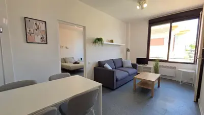 a living room with a blue couch and a table at LX137 1-Bedroom - Downtown Nice - Mobility Lease in Nice