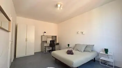 a small bedroom with a bed and a desk at LX137 1-Bedroom - Downtown Nice - Mobility Lease in Nice