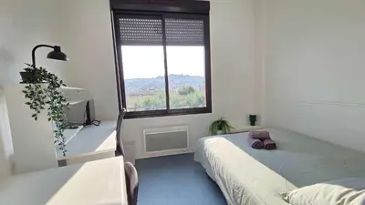 a bedroom with a bed and a window at LX144 Bright & refined studio WIFI Mobility lease in Nice