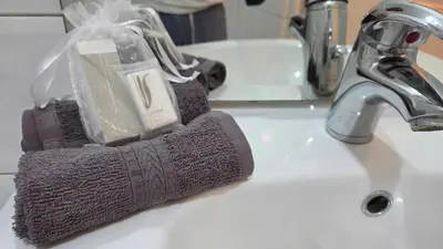 a gray sponge holder sitting on a bathroom sink at LX144 Bright & refined studio WIFI Mobility lease in Nice