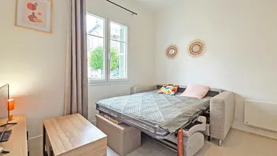 a small room with a bed and a window at LX148 Charmant studio renove Tram - Bail mobilite in Nice