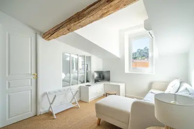 a white room with a bed and a table at Port de Nice - Cosy flat - 1 bed - AC in Nice