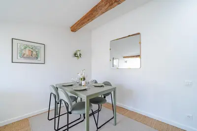 a dining room with a table and chairs at Port de Nice - Cosy flat - 1 bed - AC in Nice