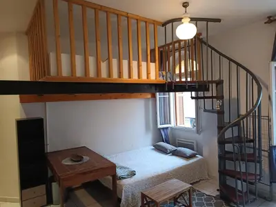 a room with a bunk bed and a staircase at Studio in Nice