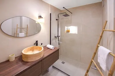 a bathroom with a wooden sink and a shower at Nice Saint Roch - Bel appartement rénové - EV in Nice