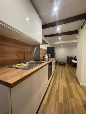 a kitchen with a sink and a counter top at Jolie studio - 2 personnes - Saint laurent du Var in Saint-Laurent-du-Var
