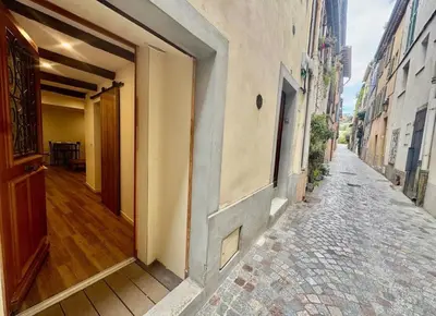 an empty alley with an open door of a building at Jolie studio - 2 personnes - Saint laurent du Var in Saint-Laurent-du-Var