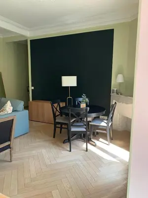 a living room with a table and chairs and a couch at Appartement et terrasse Nice centre in Nice