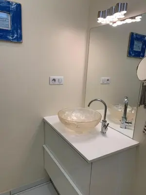 a bathroom with a bowl sink and a mirror at Appartement et terrasse Nice centre in Nice