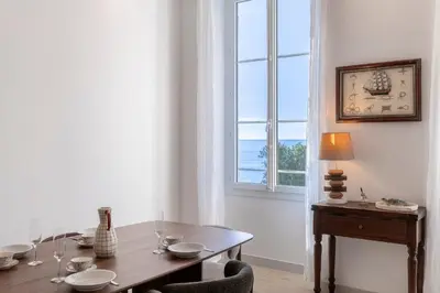a dining room with a table and a window at 