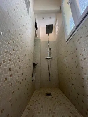 a shower in a tiled bathroom with a window at Perfectly located 1 bed apartment - Port of Nice in Nice