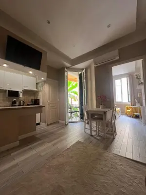 a large kitchen with a table and a dining room at Perfectly located 1 bed apartment - Port of Nice in Nice
