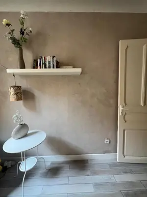 a room with a table and a shelf with books at Perfectly located 1 bed apartment - Port of Nice in Nice