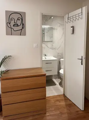 a bathroom with a sink and a toilet with a painting on the wall at Bottero nice in Nice