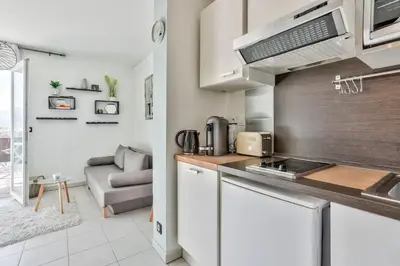 a kitchen with a sink and a stove at Heidi Braesch Apartment in Nice