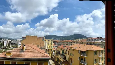 a view of a city with buildings and mountains at Beautiful 2 rooms 45 m2 Nice in Nice