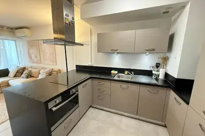 a kitchen with a sink and a counter top at Cozy apartment in the heart of Nice in Nice