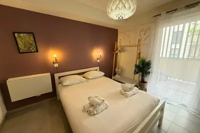 a bedroom with a bed with towels on it at Cozy apartment in the heart of Nice in Nice