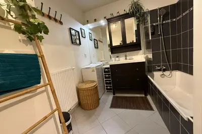 a bathroom with a sink and a bath tub and a sinkessment at Cozy apartment in the heart of Nice in Nice