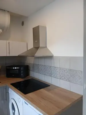 a kitchen with a sink and a stove top oven at vacances au soleil in Cagnes-sur-Mer