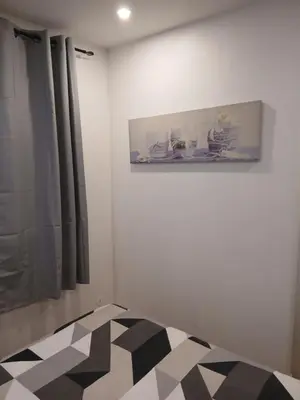 a room with a black and white checkered floor at vacances au soleil in Cagnes-sur-Mer