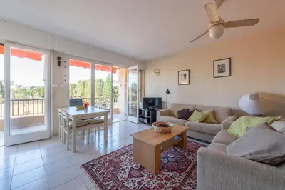 a living room with a couch and a table at fisher in Beaulieu-sur-Mer