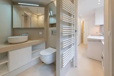 a bathroom with a toilet and a sink at Ferreira in Saint-Jean-Cap-Ferrat
