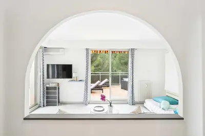a living room with a couch and a large window at LX173 Studio grande terrasse vue mer tres calme in Nice