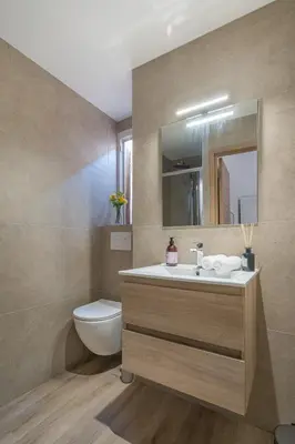 a bathroom with a sink and a toilet and a mirror at Chambre 4 La Nissa Bella in Nice