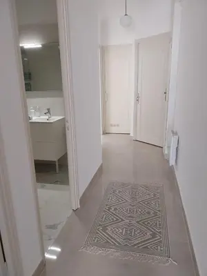 a kitchen with a table and a large window at Spacious apartment with balcony - Nice center in Nice