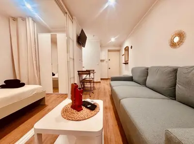 a living room with a couch and a table at Cozy apartment in the heart of Nice - 3 to 4 people in Nice