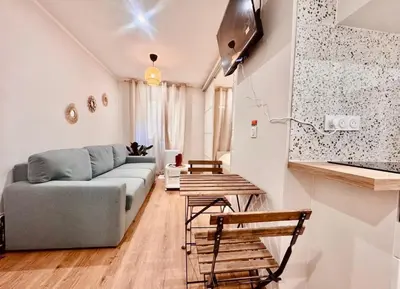 a living room with a couch and a table at Cozy apartment in the heart of Nice - 3 to 4 people in Nice