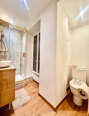 a bathroom with a toilet and a sink at Cozy apartment in the heart of Nice - 3 to 4 people in Nice