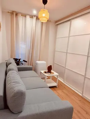 a living room with a couch and a table at Cozy apartment in the heart of Nice - 3 to 4 people in Nice