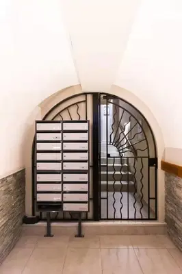 a door with a iron gate in a building at Elegant T2 Climatise Vieux Nice Garibaldi in Nice