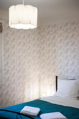 a bedroom with a bed with two towels on it at Casa Nissa Vieux-Nice in Nice