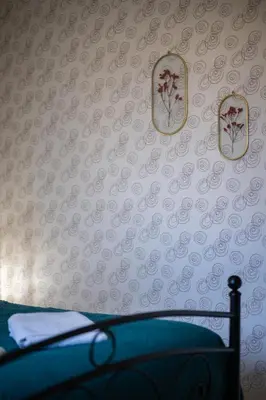 a bedroom with a wall with two mirrors and a bed at Casa Nissa Vieux-Nice in Nice