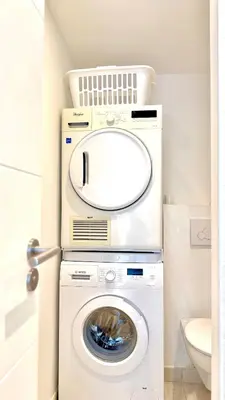 a laundry room with a washer and dryer at La Vista Mar - Apt Seaview Near Airport-AC-Parking in Saint-Laurent-du-Var