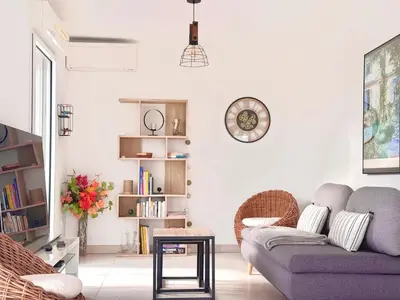 a living room with a couch and a table at La Vista Mar - Apt Seaview Near Airport-AC-Parking in Saint-Laurent-du-Var