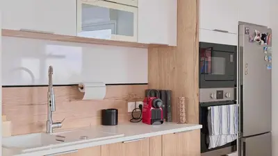 a kitchen with a sink and a refrigerator at La Vista Mar - Apt Seaview Near Airport-AC-Parking in Saint-Laurent-du-Var