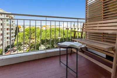 a balcony with a bench and a table with a view at Le Galion - City centre - Bright - AC - Parking in Cagnes-sur-Mer