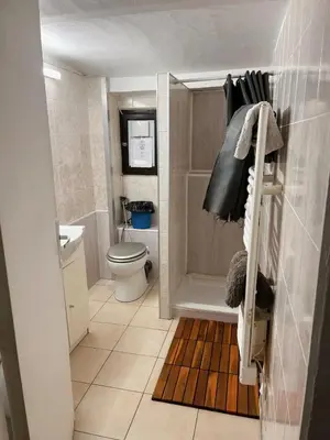a small bathroom with a toilet and a sink at appartement entresol nice 1,2 kilomètre de la plage mer promenade in Nice
