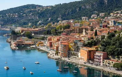 an aerial view of a city with boats in the water at Charmant studio rénové – Place de la République in Villefranche-sur-Mer