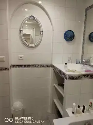 a bathroom with a sink and a mirror at 1 chambre chez l'habitant, vue mer, ville et plage in Nice