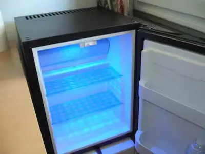 an open refrigerator with a keyboard in it at 1 chambre chez l'habitant, vue mer, ville et plage in Nice