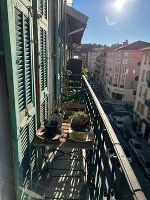 a balcony with two potted plants on a balcony at 3 pièces lumineuses, 3 nuitées minimum in Nice