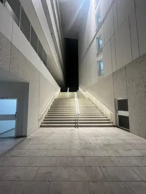 a stairway in a building with stairs leading to a tunnel at riviera in Nice