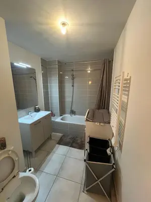 a bathroom with a tub and a sink and a toilet at riviera in Nice